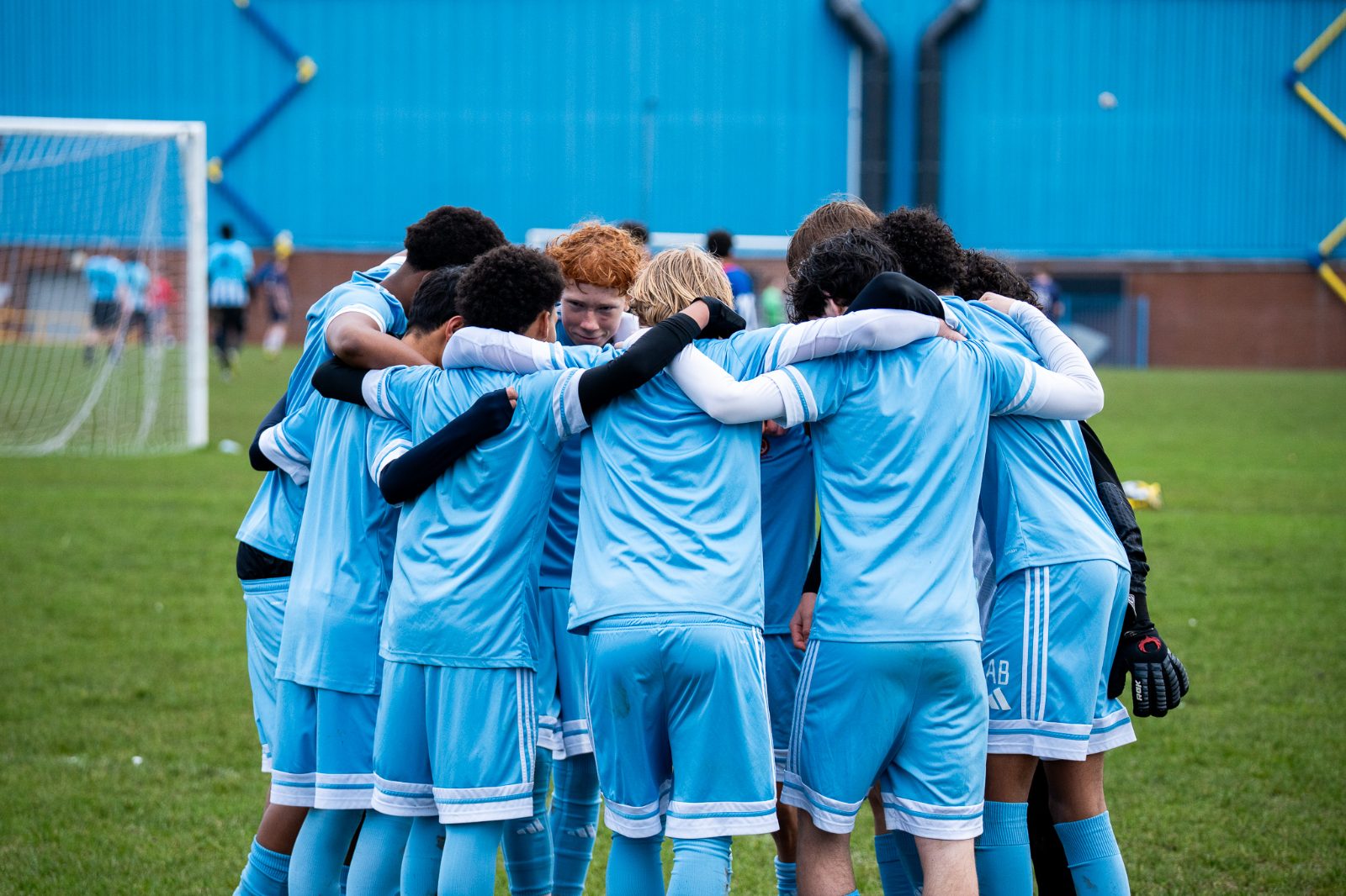 Conquest squad in a pre-match huddle